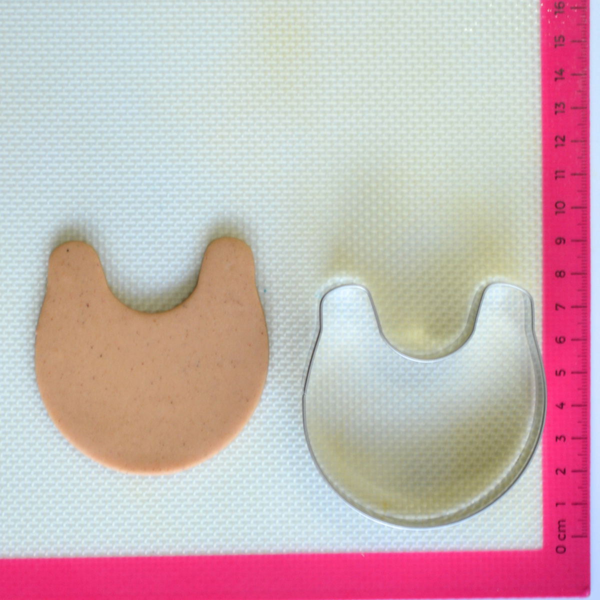 Baby bib cookie cutter with cookie dough cutout