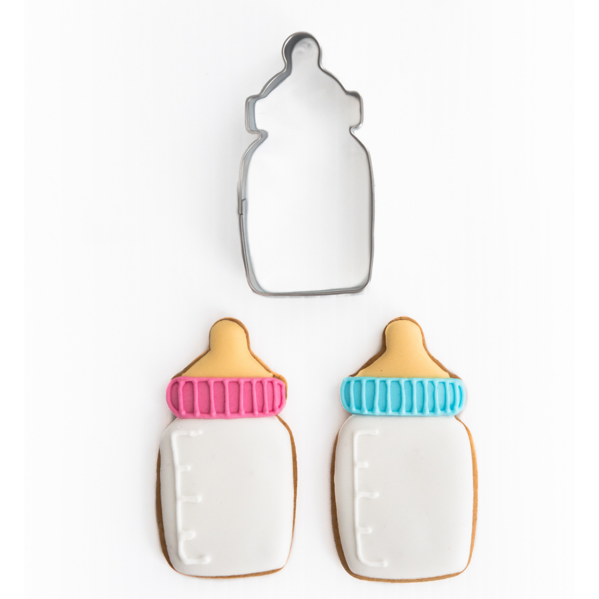 Baby bottle cookie cutter with decorated baby bottle cookies decorated with royal icing