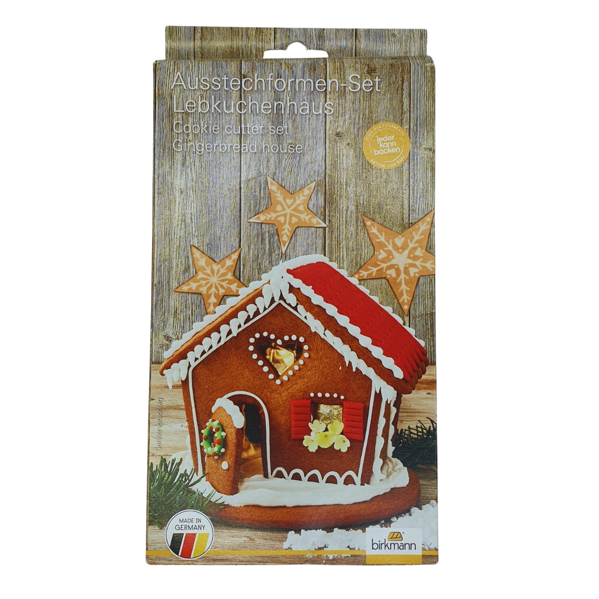 Set of cookie cutters to make cute gingerbread house for the holiday season showing the packaging the stainless steel cutters come in and featuring the image of a decorated Christmas gingerbread house.