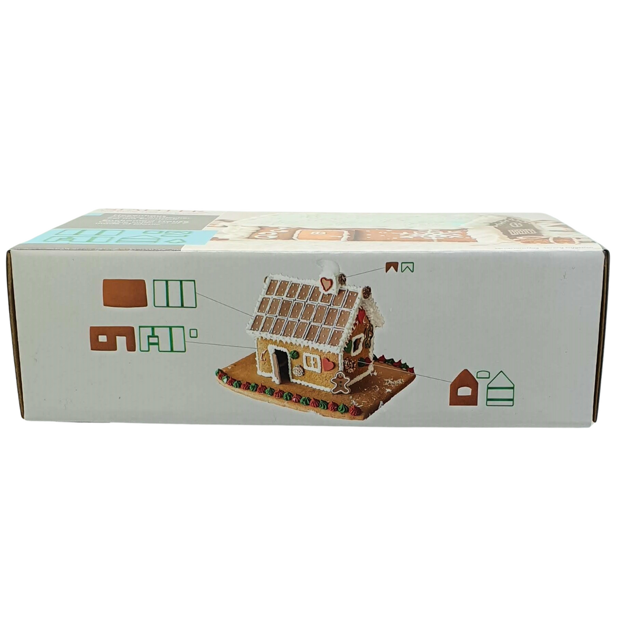 Gingerbread house set of cookie cutters in packaging top view showing beautiful christmas themed  christmas decorations.