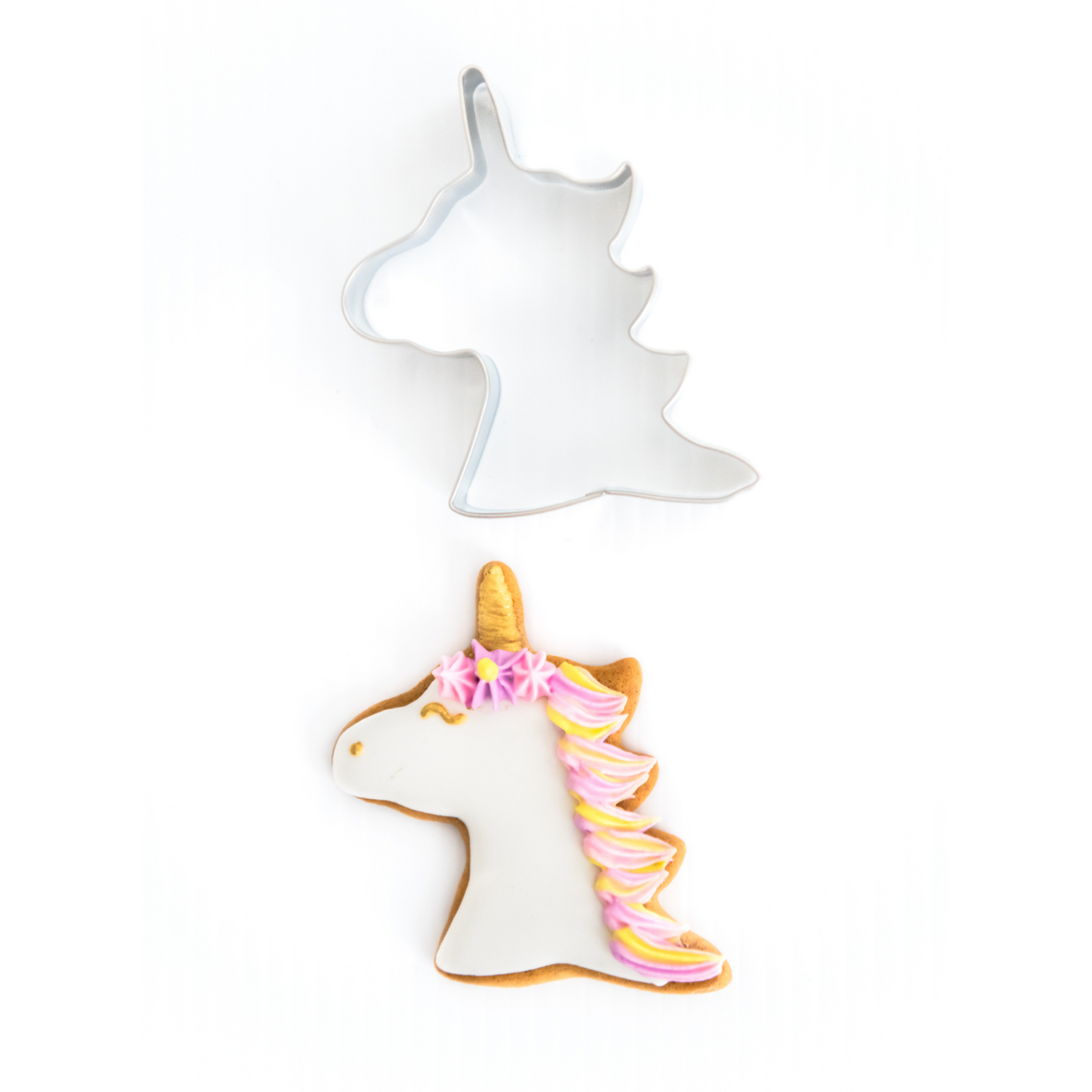 Royal icing decorated unicorn head with stainless steel cookkie cutter