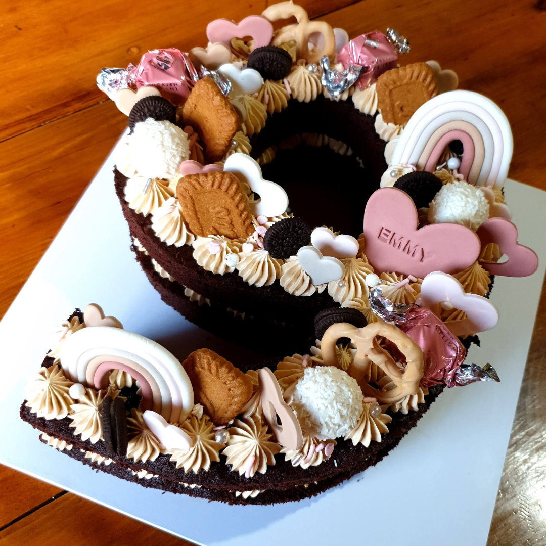 Number 9 chocolate cake with biscoff flavoured swiss meringue buttercream.  The cake was cut out using a reusable baking stencil in the number 9 shape.